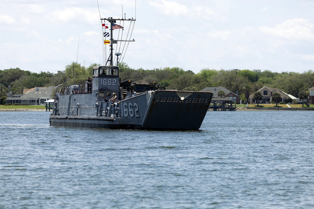 A landing craft utility approaches the sand ramp May 5, 2026, at Marine Corps Support Facility Blount Island in Jacksonville, Florida, enabling ship-to-shore operations for the 22nd Marine Expeditionary Unit (Special Operations Capable). The movement supported rapid equipment transfer to sustain operations in the U.S. Southern Command area of responsibility. (U.S. Marine Corps photo by Dustin Senger)
