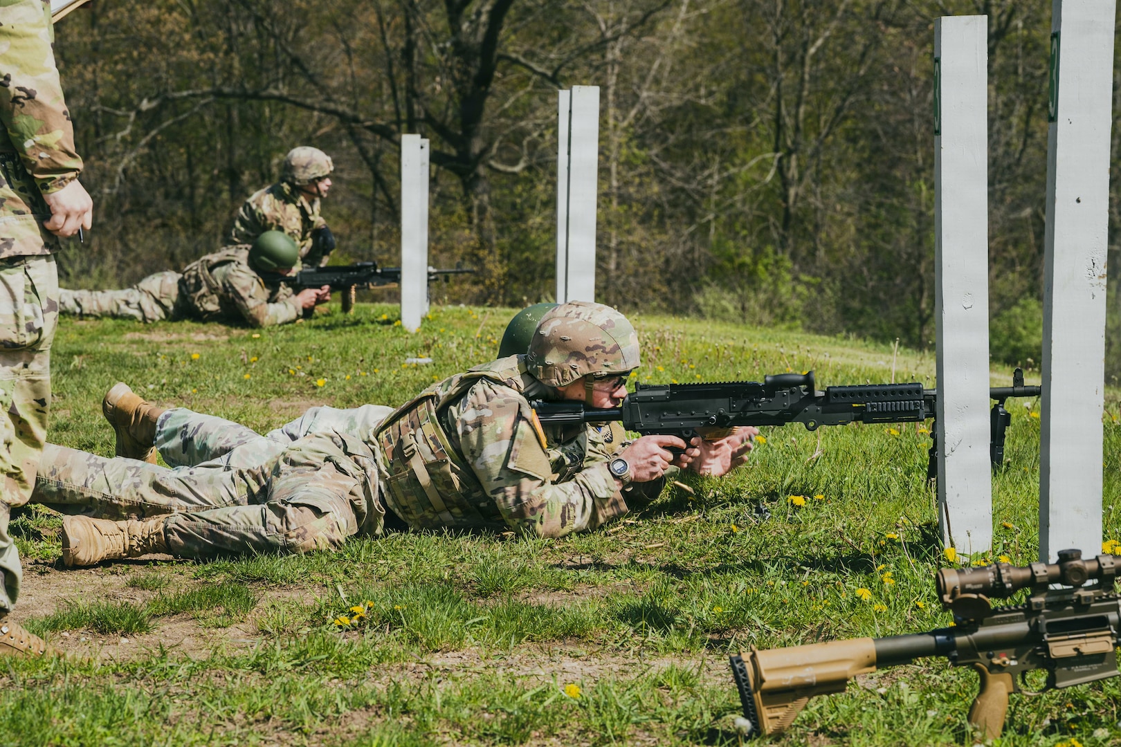 Indiana National Guard Spc. Caleb Chambers, an infantryman with the 1st Battalion, 151st Infantry Regiment, fires an M240 machine gun during a qualification event at the Region IV Best Warrior Competition at Fort Custer Training Center, Michigan, April 30, 2026.