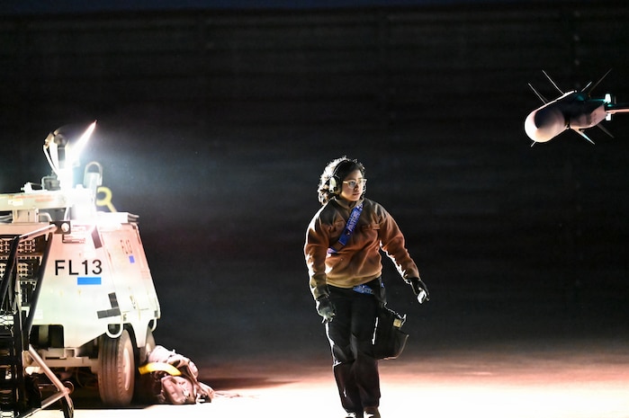 U.S. Air Force Staff Sgt. Katherine Cota, 35th Fighter Squadron weapons team chief, conducts pre-flight checks for night flying operations during exercise Freedom Flag 26-1 at Gwangju Air Base, Republic of Korea, April 20, 2026. Throughout the exercise, the 31st AEW synchronized joint and combined airpower through operational command and control across the battlespace. (U.S. Air Force photo by 2nd Lt. Daniel White)