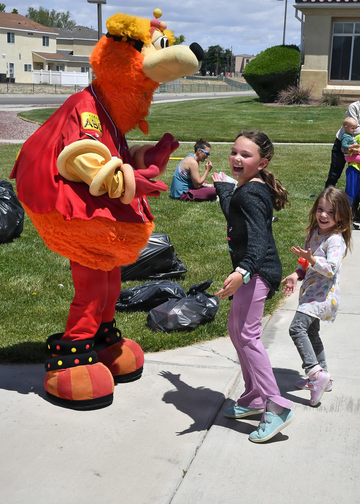Child playing with Mascot.