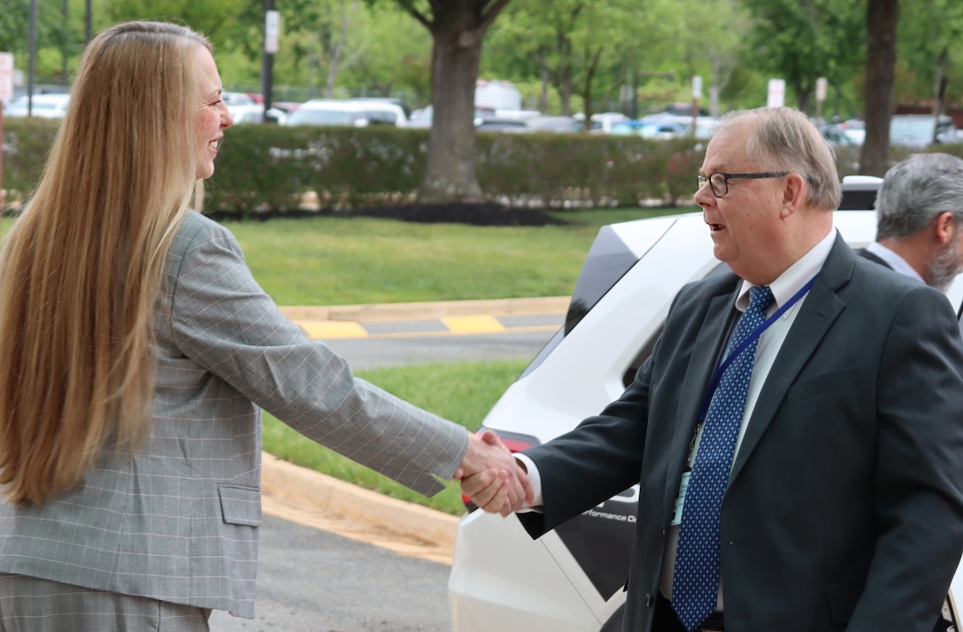 Director Desautel shaking hands with Honorable Powers.