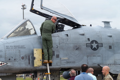 A U.S. Air Force pilot climbs into an A-10 Thunderbolt II during a static display for Gathering of Eagles and National Security Forum attendees at Maxwell Air Force Base, Alabama, May 6, 2026.