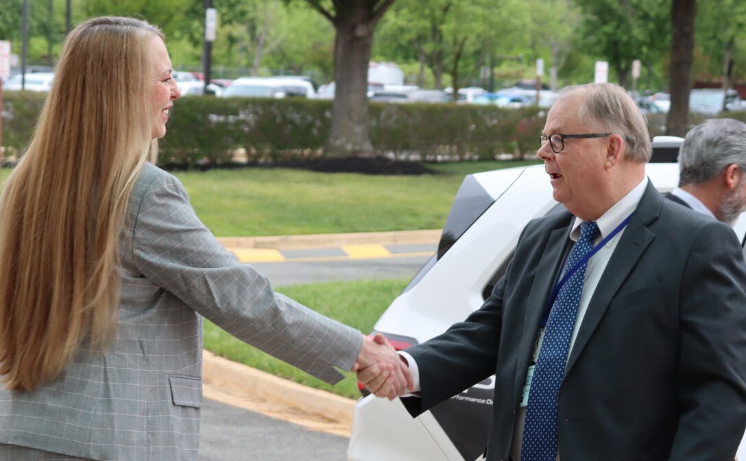 Director Desautel shaking hands with Honorable Powers