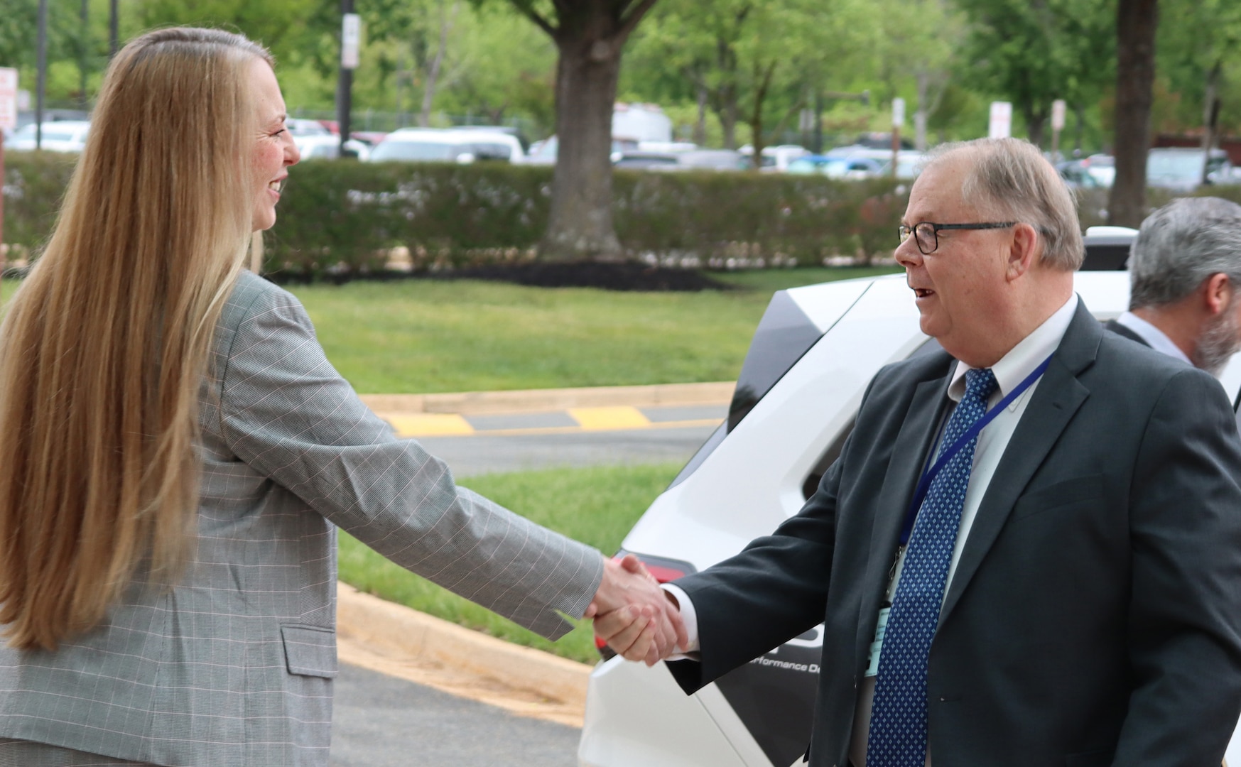 Director Desautel shaking hands with Honorable Powers