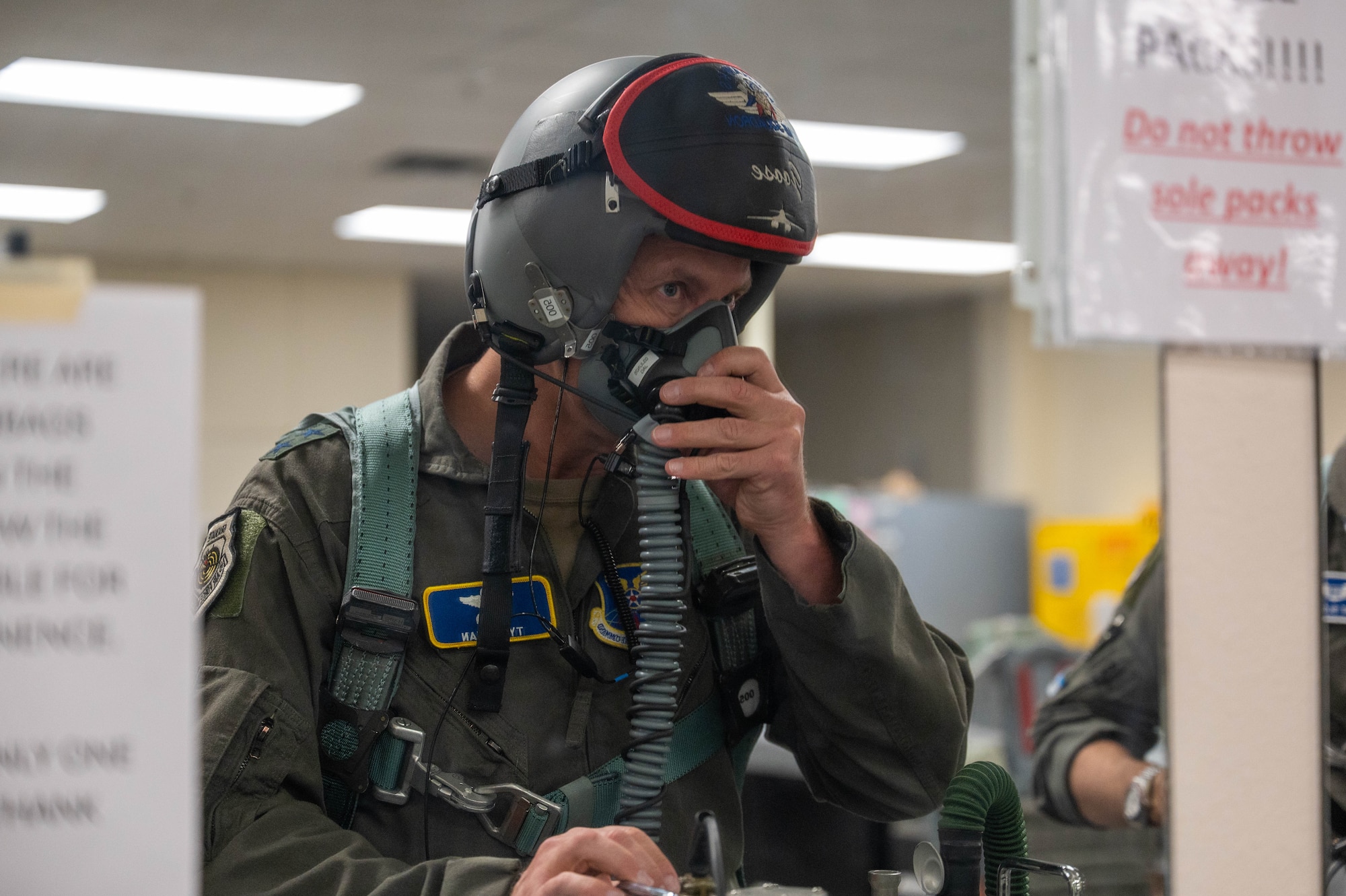 U.S. Air Force Maj. Gen. Ty Neuman, Eighth Air Force and Joint-Global Strike Operations Center commander, tests his flight equipment at Dyess Air Force Base, Texas, May 5, 2026. Proper fitting and testing of oxygen systems is a mandatory safety requirement that ensures aircrew survivability and clear communication during high-altitude bomber flights. (U.S. Air Force photo by Airman 1st Class William Neal)