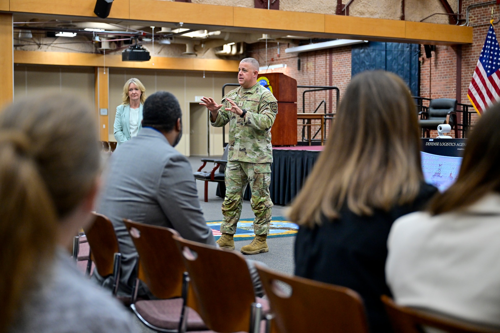 A military officer talks to audience members.