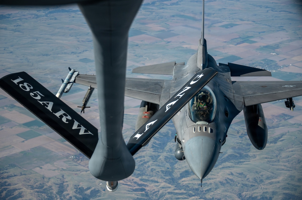 Capt. Michael Considine, an F-16 Fighting Falcon pilot assigned to the 114th Fighter Wing, prepares to receive fuel from a KC-135 Stratotanker assigned to the 185th Air Refueling Wing, Iowa Air National Guard, during a mission over the Midwest, May 1, 2026. Aerial refueling extends the range and endurance of aircraft, enabling global mobility operations. (U.S. Air National Guard photo by Staff Sgt. John Johnson)