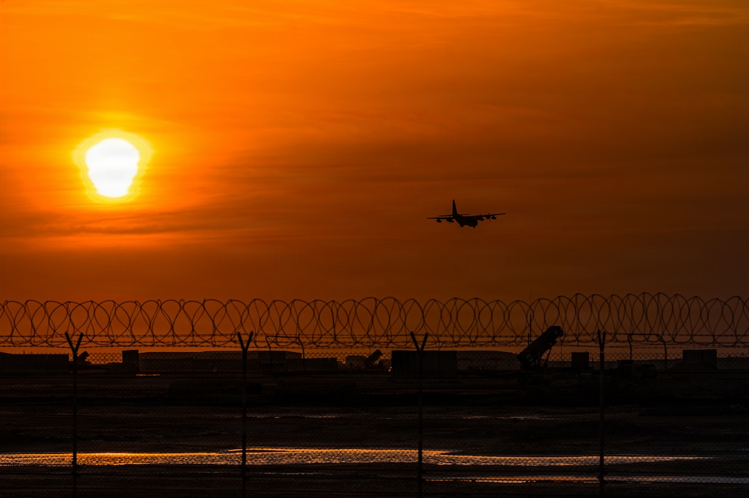 A C-130 Hercules prepares to land at an undisclosed location in the Middle East at sunset