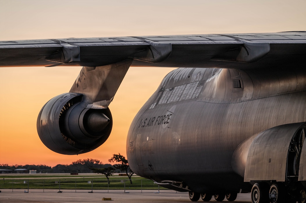 A C-5M Super Galaxy assigned to the 433rd Airlift Wing sits on the ramp.
