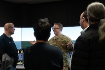 Members of the Community Leadership Institute (CLI) learn about air traffic control (ATC) tower operations at Minot Air Force Base, North Dakota, April 30, 2026. The CLI members learned about ATC responsibilities, such as controlling and regulating en route and terminal air traffic. (U.S. Air Force photo by Airman Ben Selchow)