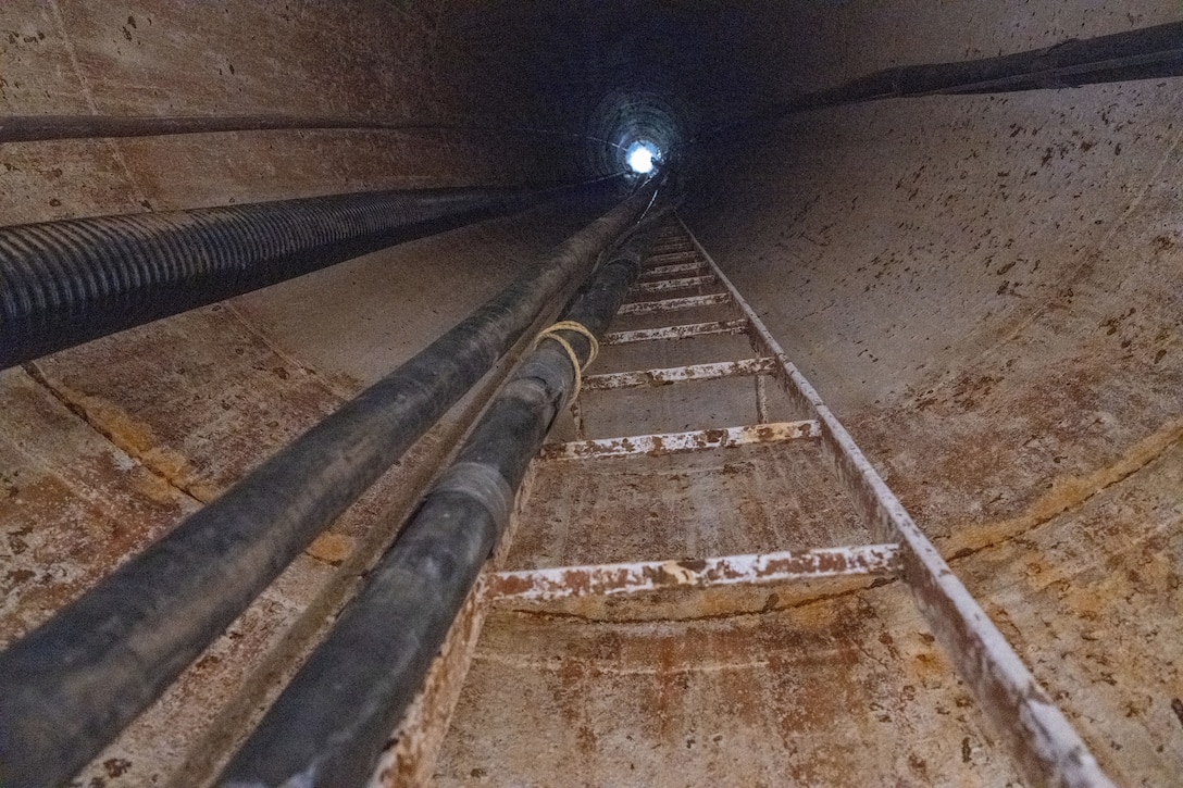 The empty main water column receives hosing as construction on the water tower occurs.
