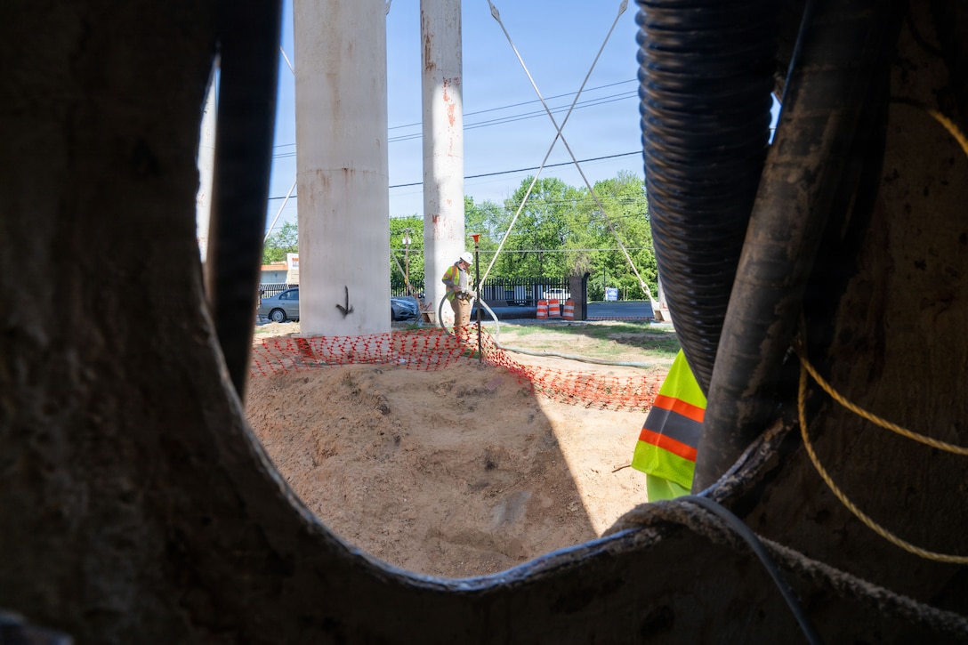 John O’Keefe, construction site superintendent, mobilizes equipment to prepare for sand blasting the interior and exterior of the water tower.