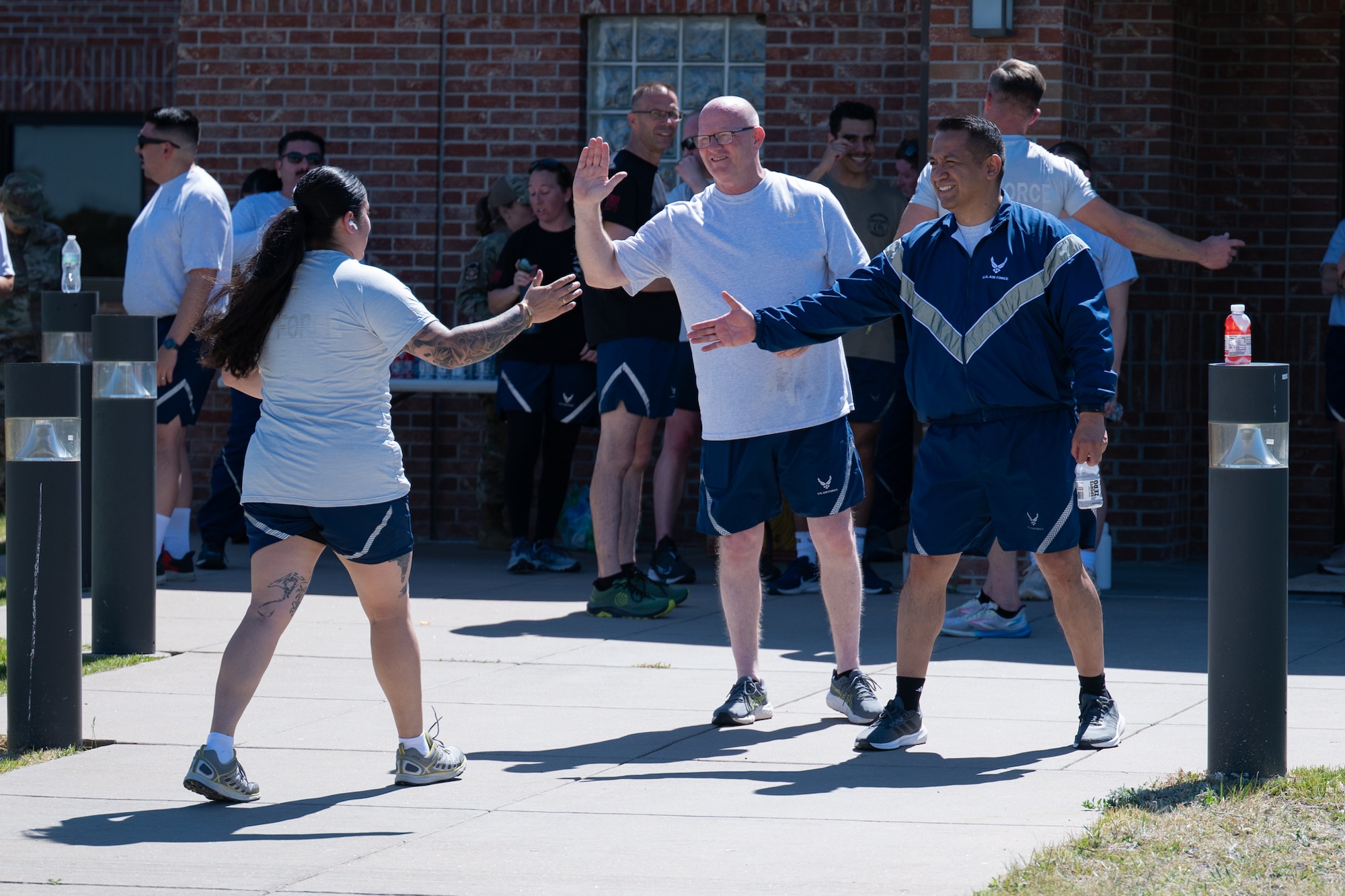 Airmen receive congratulations after finishing a two-mile run.
