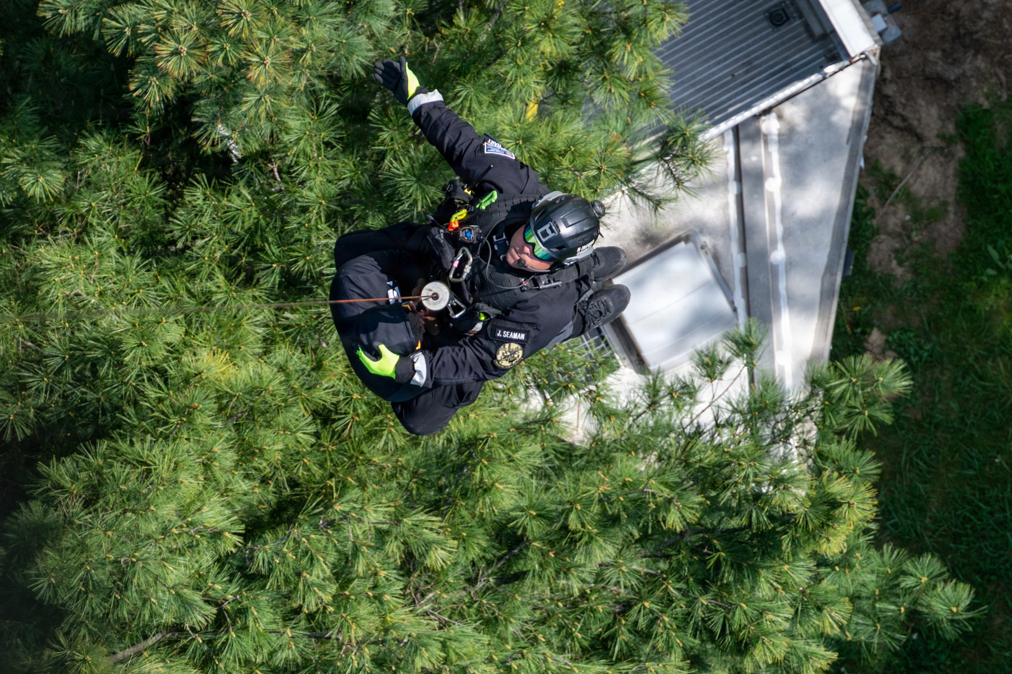 A technician from the Maryland Helicopter Aquatic Response Team and a member of the Maryland Air National Guard Student Flight are hoisted by a Maryland Army National Guard UH-60 Black Hawk during a Maryland Emergency Management Search-and-Rescue Exercise at Gunpowder Falls State Park, Maryland, April 23, 2026.