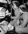 Image of nurses treating patients.