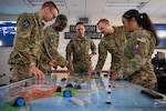 Guardians assigned to Space Delta 5 conduct military planning Dec. 18, 2025, at Vandenberg Space Force Base, Calif. Space Delta 5 supports and presents combat-ready forces to command and control the Combined Space Operations Center, which closes blue kill chains by delivering space-enabled effects —including GPS, missile warning and electromagnetic interference detection — to the Joint Force. (Photo by David Dozoretz)