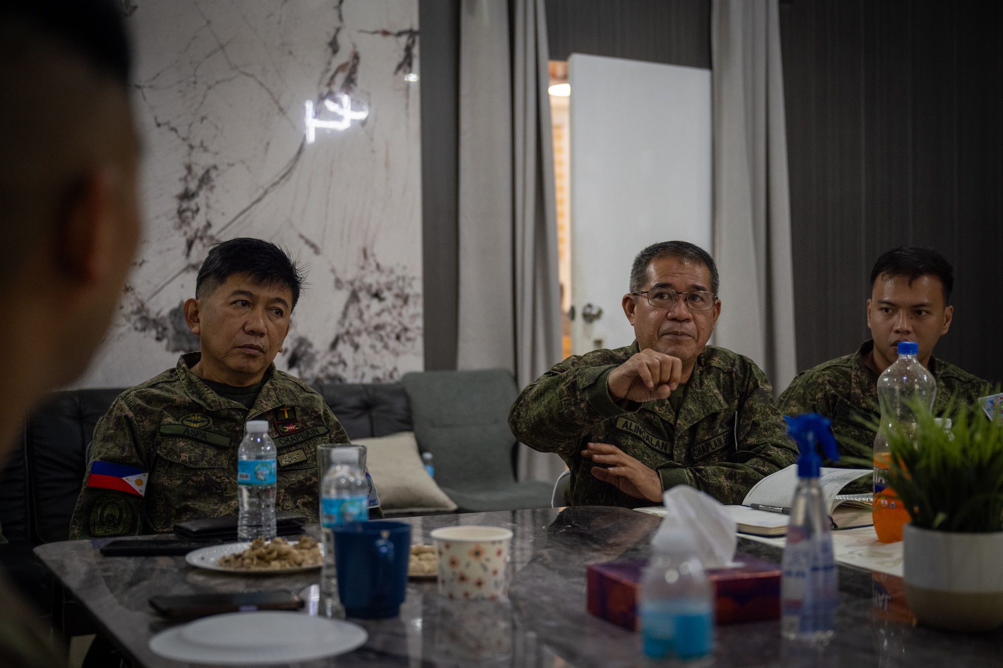Philippine Air Force Lt. Col. Dennis Alingalan, Headquarters Service Support Group chief of chaplain services management, speaks during a chaplain fellowship exchange at Clark Air Base, Philippines, April 22, 2026. Chaplains from the PAF and the 21st Air Expeditionary Wing chaplain assembled to increase understanding from each organization and discuss potential outreach opportunities. (U.S. Air Force photo by Airman 1st Class Adrien Tran)