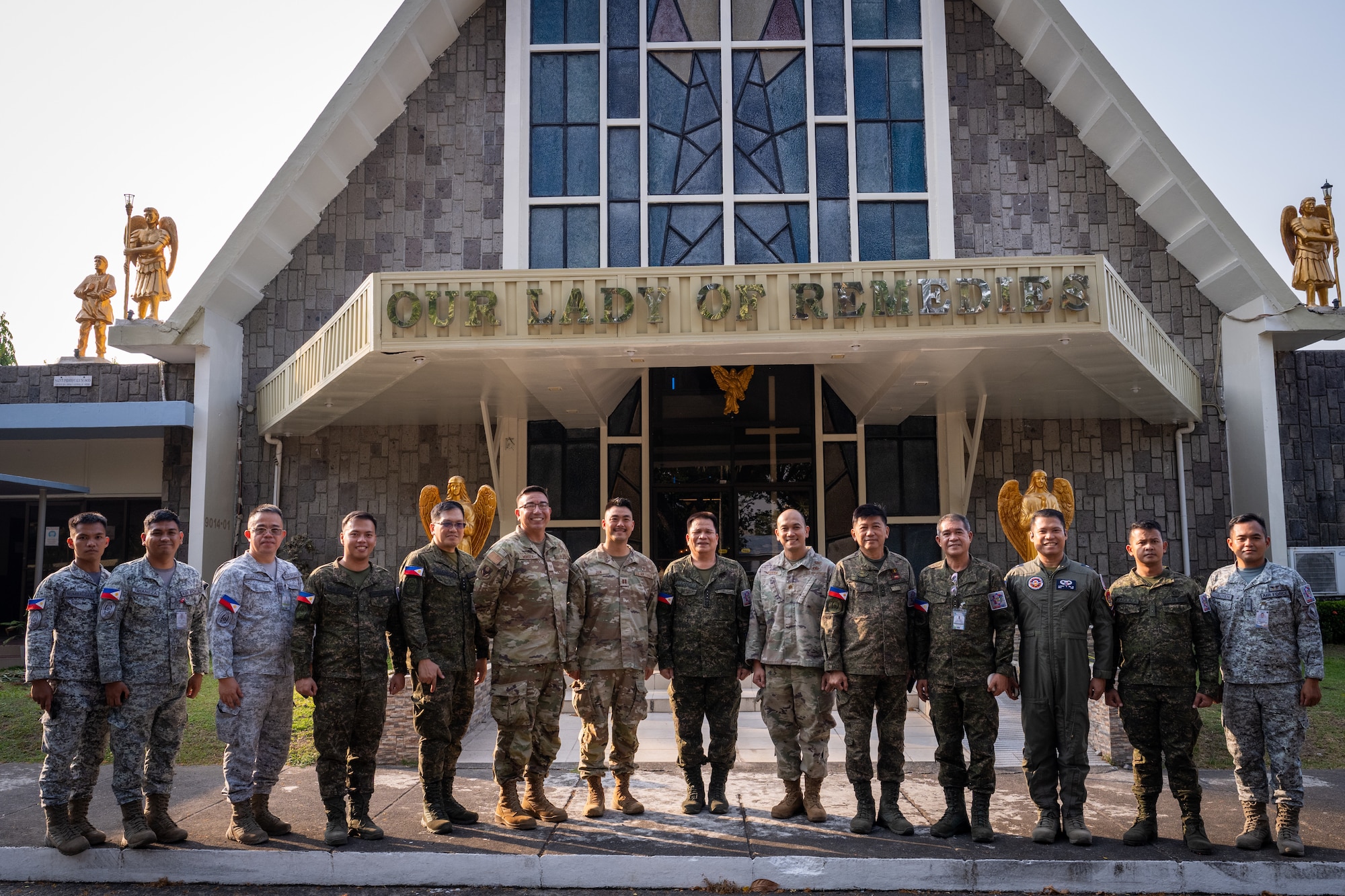 U.S. Air Force Airmen and Philippines Air Force Airmen pose for a group photo during a chaplain fellowship exchange at Clark Air Base, Philippines, April 22, 2026. Military chaplains provide confidential spiritual care, moral guidance, and resilience support to service members and their families, advising commanders on religious matters and ensuring the free exercise of religion across the force. (U.S. Air Force photo by Airman 1st Class Adrien Tran)