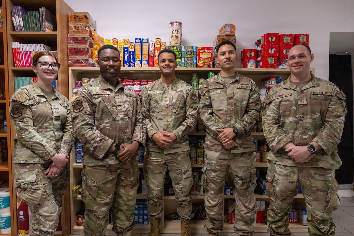 Airmen pose for a photo.