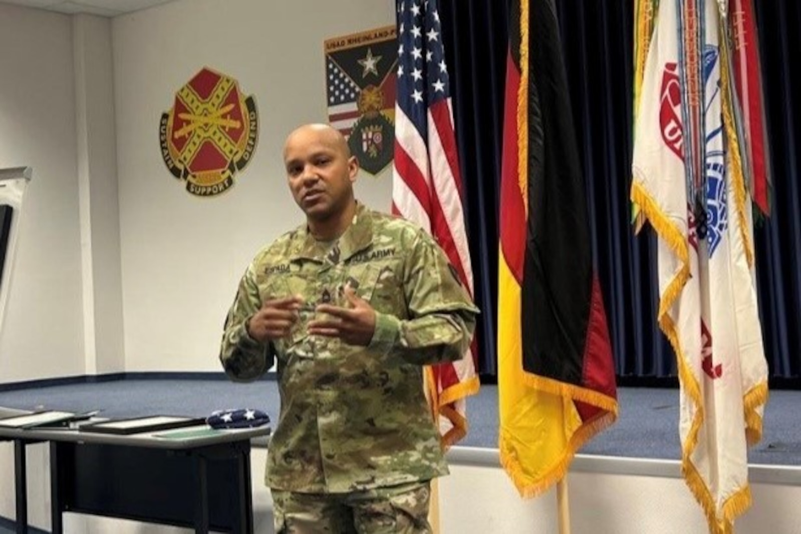 man standing in front of flags