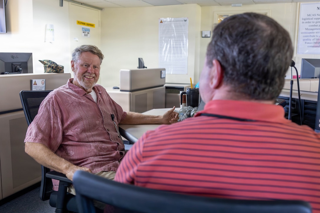 James Capps, information technology facilities manager, Marine Corps Installations East-Marine Corps Base Camp Lejeune, converses with a coworker as part of an energy resilience and readiness exercise at Marine Corps Air Station New River, Jacksonville, North Carolina, May 5, 2026. The exercise tested not only the resiliency of the infrastructure to support operations without commercial energy, but the resiliency of the uniformed and civilian personnel who live and work on the air station. (U.S. Marine Corps photo by Lance Cpl. Erica S. Padgett)