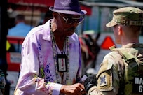 Louisiana National Guard Soldiers conduct a roving patrol as part of Task Force NOLA's efforts to support enhanced security at the French Quarter Fest.