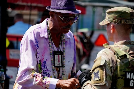 Louisiana National Guard Soldiers conduct a roving patrol as part of Task Force NOLA's efforts to support enhanced security at the French Quarter Fest.