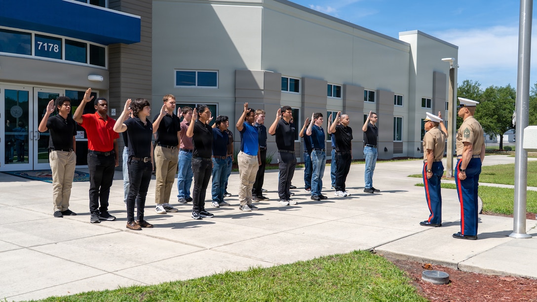 U.S. Marine Corps Maj. Matthew C. Weber, commanding officer of Recruiting Station Jacksonville, administers the oath of enlistment to applicants at the Military Entrance Processing Station in Jacksonville, Florida, May 5, 2026. The Oath of Enlistment is a significant milestone for applicants, representing their formal commitment to serve and defend the Constitution of the United States as they begin their journey toward earning the title of Marine. (U.S. Marine Corps photo by Sgt. Cody Purcell)