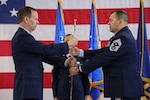 Passing of a ceremonial saber to Chief Master Sgt. Michael Alvarez