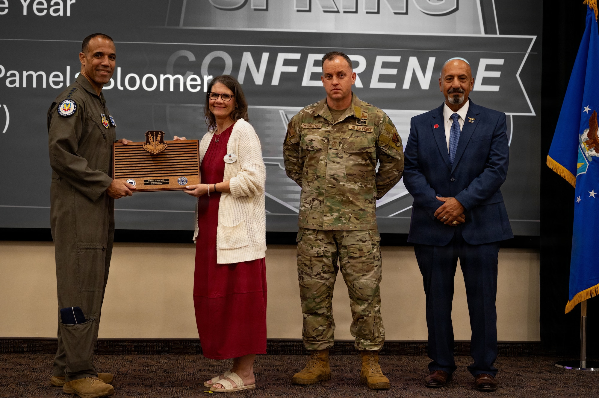 Ms. Pamela S. Bloomer, 609th Air Communications Squadron, receives the Civilian Category II of the year award during the 2026 Air Combat Command’s Outstanding Airmen of the Year Award ceremony at Joint Base Langley-Eustis, Virginia, May 6, 2026. Award winners were recognized by senior leaders from across the major command. (U.S. Air Force photo by Staff Sgt. Michael Bowman)