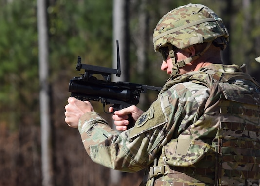 Brigadier General Joe Jarrard, Georgia’s Adjutant General, fires an M320 grenade launcher with members of the Georgia Army National Guard’s 221st Military Intelligence Battalion at Fort Benning, Ga