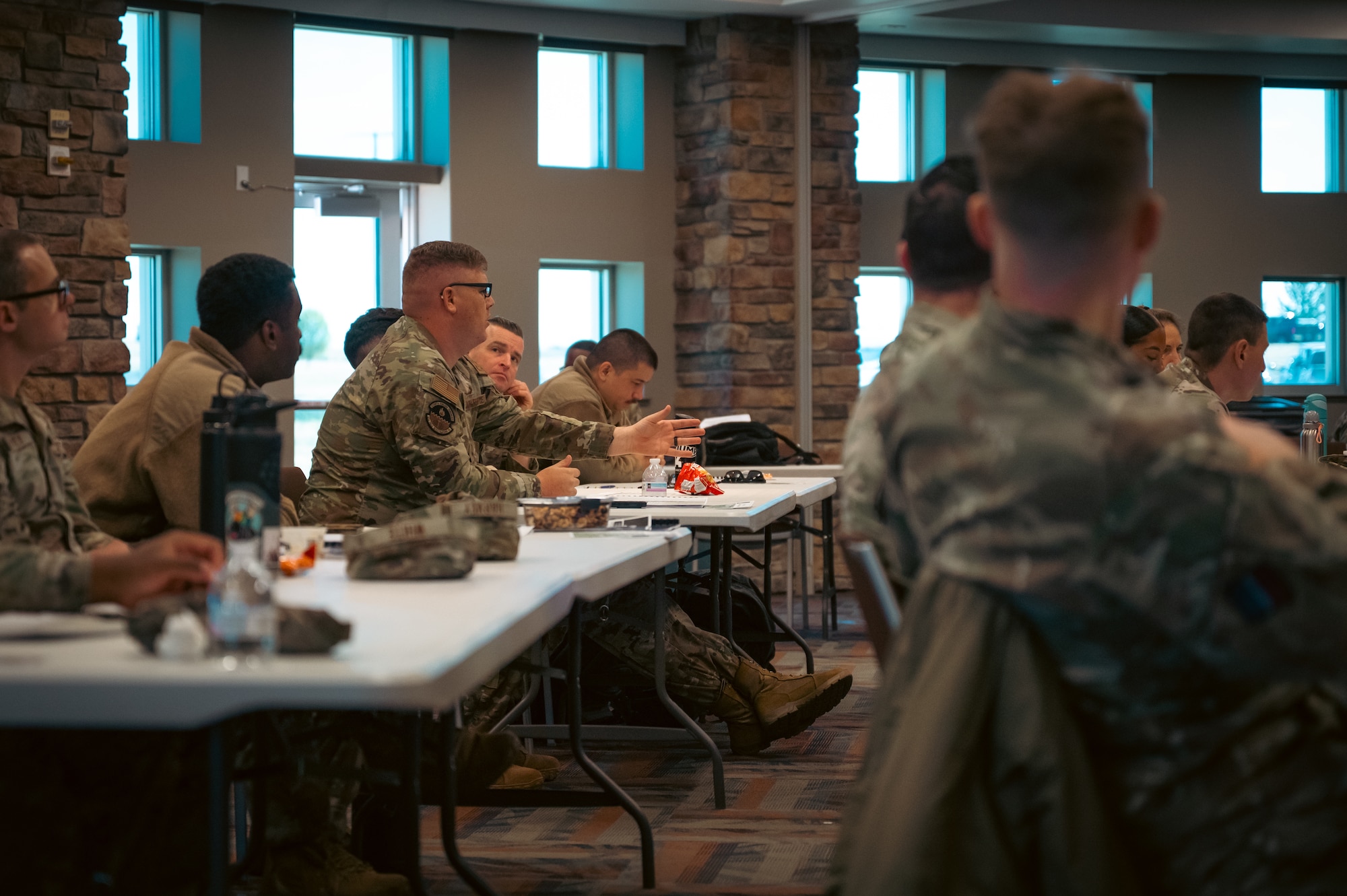 people sit at tables in attendance