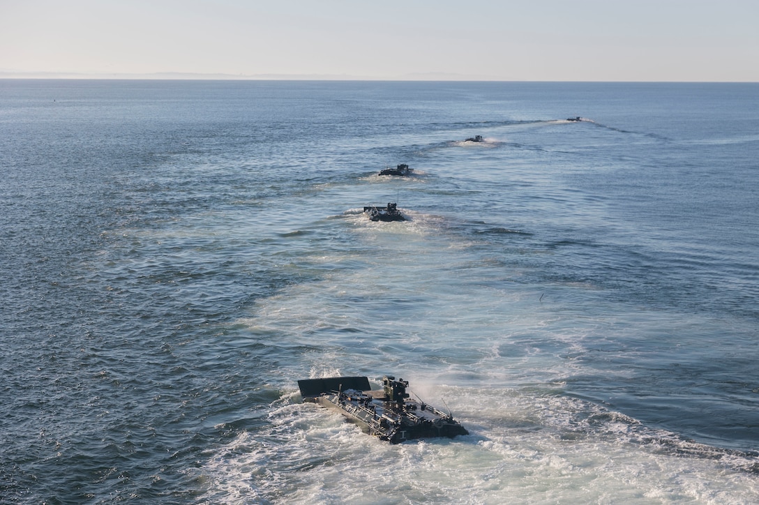 U.S. Marine Corps amphibious combat vehicles with 3rd Assault Amphibian Battalion, 1st Marine Division, I Marine Expeditionary Force, launch from amphibious transport dock ship USS Somerset (LPD 25) for open ocean launch drills during Quarterly Underway Amphibious Readiness Training 25.2 while underway in the Pacific Ocean, March 9, 2025. QUART is a joint training exercise designed to develop and sustain essential amphibious readiness skills for effective operations in maritime environments while reinforcing the Navy-Marine Corps partnership. (U.S. Marine Corps photo by Gunnery Sgt. Stephanie Cervantes)