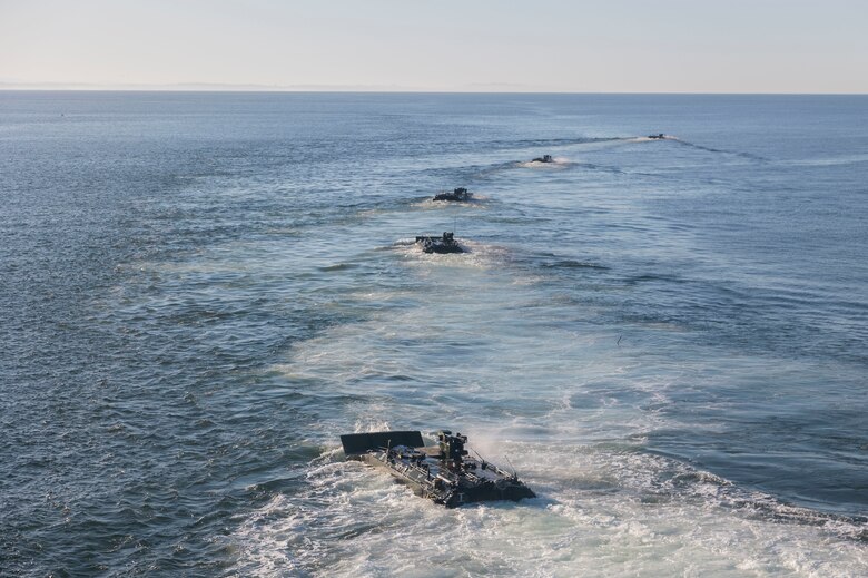 U.S. Marine Corps amphibious combat vehicles with 3rd Assault Amphibian Battalion, 1st Marine Division, I Marine Expeditionary Force, launch from amphibious transport dock ship USS Somerset (LPD 25) for open ocean launch drills during Quarterly Underway Amphibious Readiness Training 25.2 while underway in the Pacific Ocean, March 9, 2025. QUART is a joint training exercise designed to develop and sustain essential amphibious readiness skills for effective operations in maritime environments while reinforcing the Navy-Marine Corps partnership. (U.S. Marine Corps photo by Gunnery Sgt. Stephanie Cervantes)