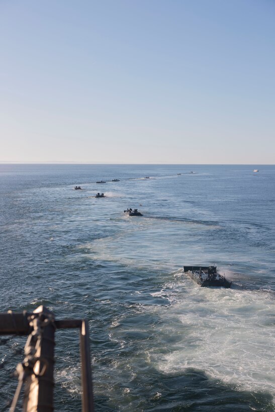 U.S. Marine Corps amphibious combat vehicles with 3rd Assault Amphibian Battalion, 1st Marine Division, I Marine Expeditionary Force, launch from amphibious transport dock ship USS Somerset (LPD 25) for open ocean launch drills during Quarterly Underway Amphibious Readiness Training 25.2 while underway in the Pacific Ocean, March 9, 2025. QUART is a joint training exercise designed to develop and sustain essential amphibious readiness skills for effective operations in maritime environments while reinforcing the Navy-Marine Corps partnership. (U.S. Marine Corps photo by Gunnery Sgt. Stephanie Cervantes)