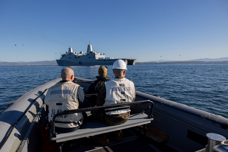 U.S. Marine Corps Col. Caleb Hyatt, right, commanding officer of the 11th Marine Expeditionary Unit, I Marine Expeditionary Force, and U.S. Navy Command Master Chief James Butler, with amphibious transport dock ship USS Somerset (LPD 25), supervise open ocean launch drills during Quarterly Underway Amphibious Readiness Training 25.2 while underway in the Pacific Ocean, March 9, 2025. QUART is a joint training exercise designed to develop and sustain essential amphibious readiness skills for effective operations in maritime environments while reinforcing the Navy-Marine Corps partnership. (U.S. Marine Corps photo by Cpl. Oliver Nisbet)