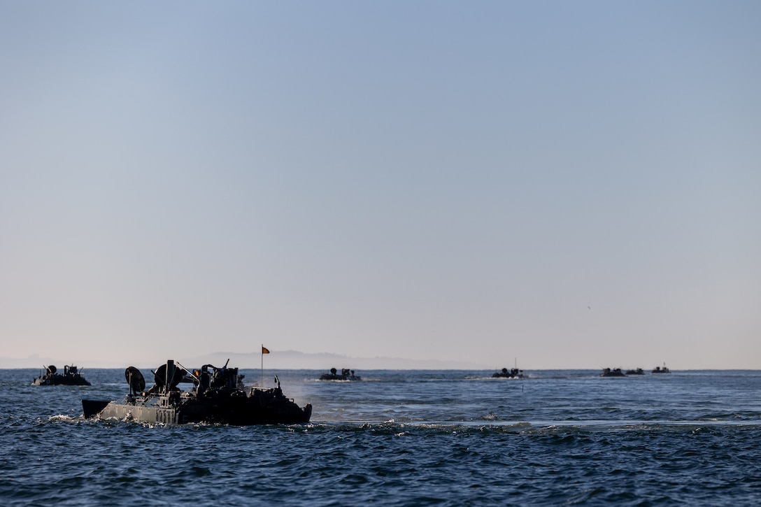 U.S. Marine Corps amphibious combat vehicles with 3rd Assault Amphibian Battalion, 1st Marine Division, I Marine Expeditionary Force, maneuver in the open ocean during Quarterly Underway Amphibious Readiness Training 25.2 while underway in the Pacific Ocean, March 9, 2025. QUART is a joint training exercise designed to develop and sustain essential amphibious readiness skills for effective operations in maritime environments while reinforcing the Navy-Marine Corps partnership. (U.S. Marine Corps photo by Cpl. Oliver Nisbet)