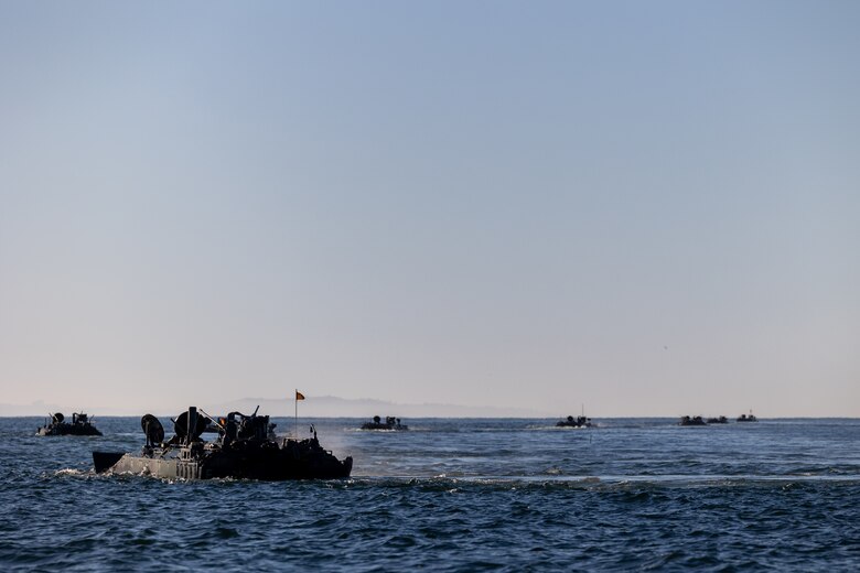 U.S. Marine Corps amphibious combat vehicles with 3rd Assault Amphibian Battalion, 1st Marine Division, I Marine Expeditionary Force, maneuver in the open ocean during Quarterly Underway Amphibious Readiness Training 25.2 while underway in the Pacific Ocean, March 9, 2025. QUART is a joint training exercise designed to develop and sustain essential amphibious readiness skills for effective operations in maritime environments while reinforcing the Navy-Marine Corps partnership. (U.S. Marine Corps photo by Cpl. Oliver Nisbet)