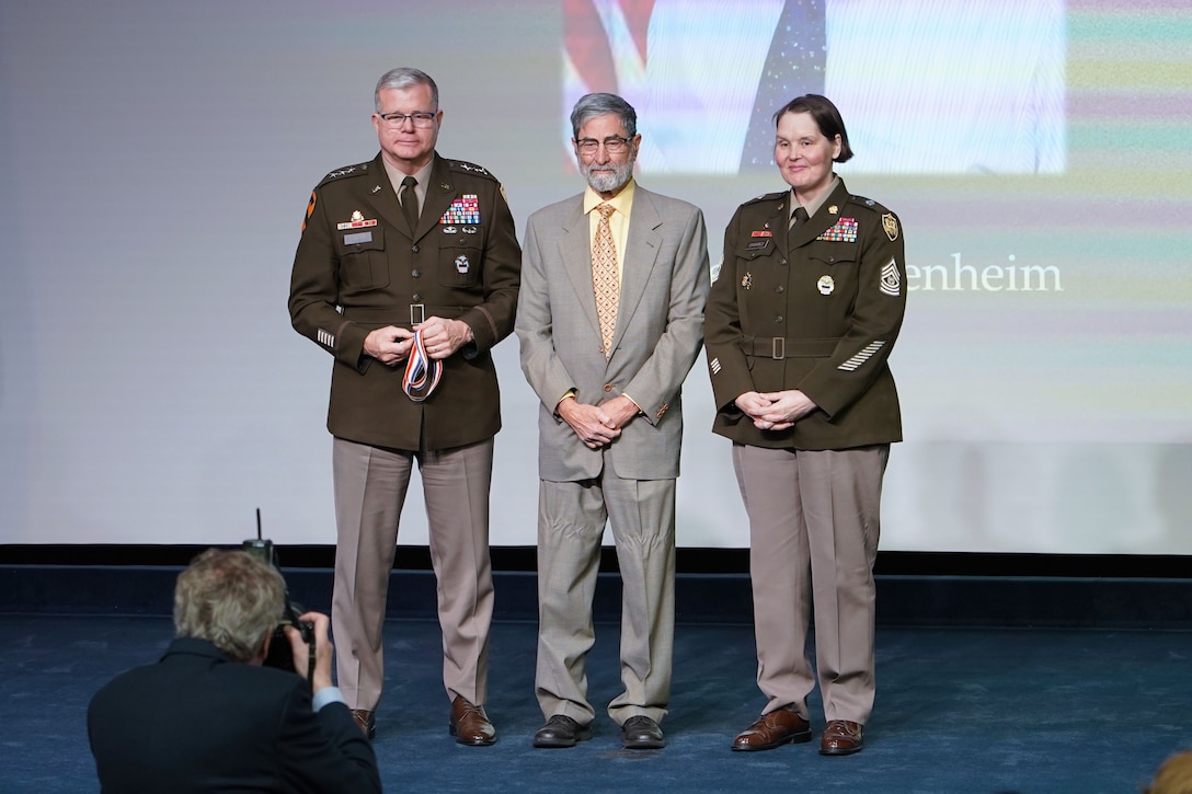 speaking on stage and receiving an award