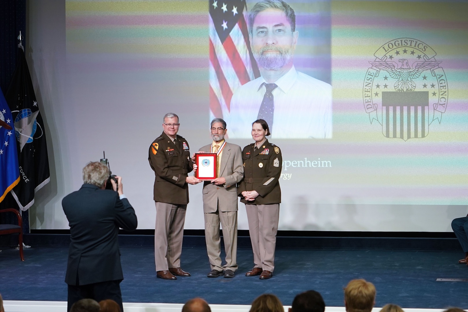 speaking on stage and receiving an award