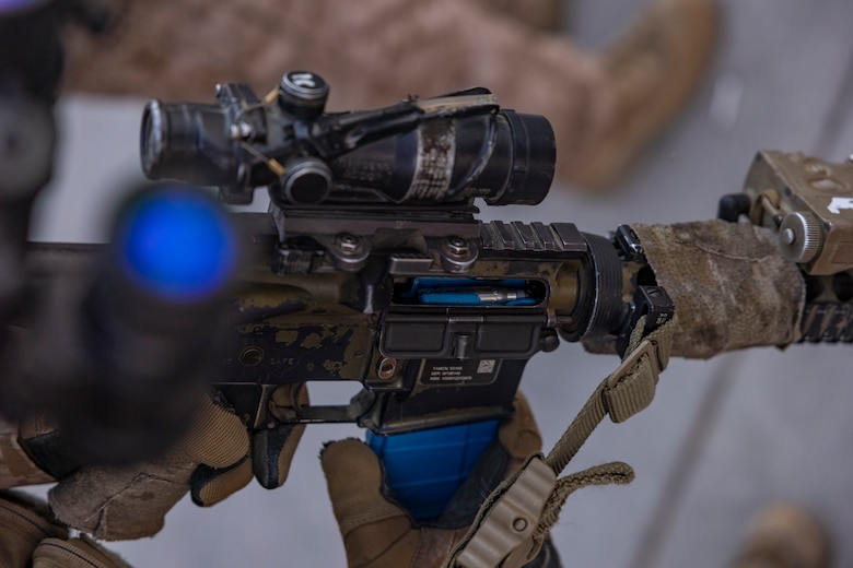 A U.S. Marine with the Maritime Raid Force, 11th Marine Expeditionary Unit, loads a magazine during Realistic Urban Training at Marine Corps Air Station Yuma, Arizona, Nov. 10, 2025. RUT is a land-based training exercise that enables the 11th MEU to conduct expeditionary operations as a cohesive Marine Air-Ground Task Force in preparation for amphibious operations alongside the U.S. Navy. (U.S. Marine Corps photo by Cpl. Oliver Nisbet)