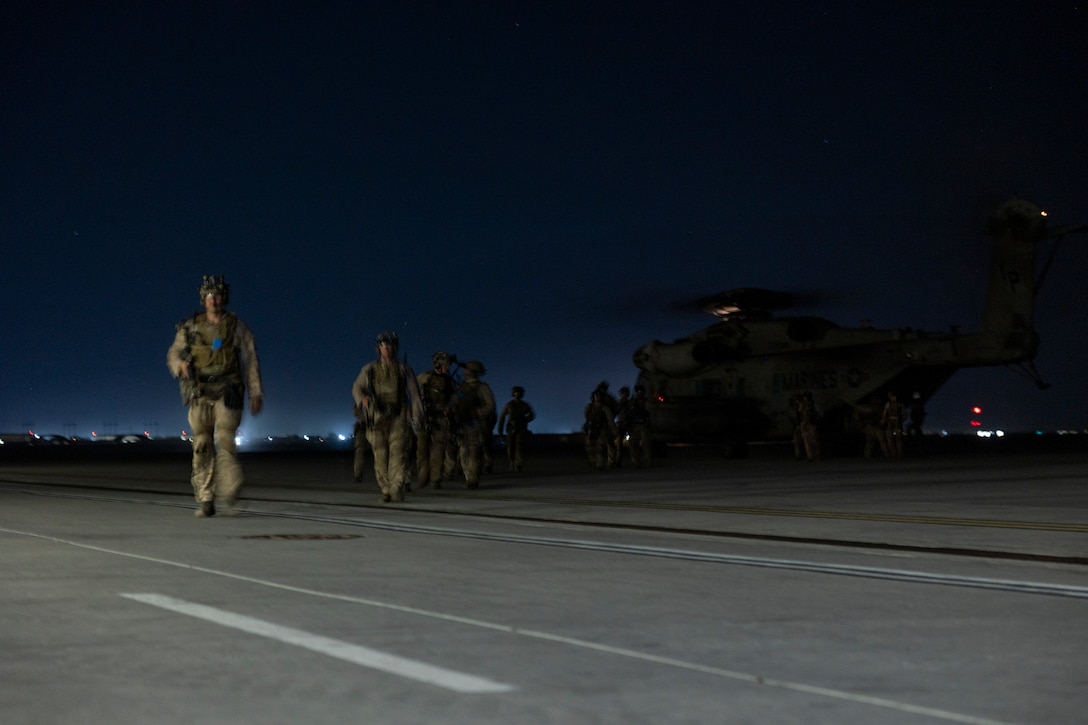 U.S. Marines and Sailors with the Maritime Raid Force, 11th Marine Expeditionary Unit, disembark a CH-53E Super Stallion following a raid during Realistic Urban Training at Marine Corps Air Station Yuma, Arizona, Nov. 10, 2025. RUT is a land-based training exercise that enables the 11th MEU to conduct expeditionary operations as a cohesive Marine Air-Ground Task Force in preparation for amphibious operations alongside the U.S. Navy. (U.S. Marine Corps photo by Cpl. Oliver Nisbet)