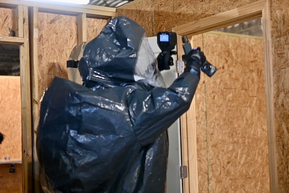 A U.S. Army Soldier with the 4th Civil Support Team, 201st Regional Support Group, Georgia Army National Guard, surveys a doorway for any simulated chemical, biological or radiological contaminants during exercise Patriot 25, at the Guardian Centers in Perry, Georgia, March 26, 2025. Approximately 700 participants from the National Guard as well as federal, state, and local agencies are taking part in Patriot 25, a National Guard-sponsored exercise designed to enhance domestic response readiness and interagency coordination. (U.S. Army National Guard photo by Maj. Amanda Russell)