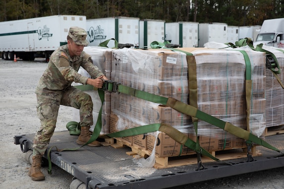 U.S. Army Spc. Myers Heidt, a motor transport operator with the Rome-based 1160th Transportation Company, 265th Chemical Battalion, 201st Regional Support Group, Georgia Army National Guard, unloads a pallet of emergency meals during the aftermath of Hurricane Helene at a Georgia Emergency Management Agency (GEMA) disaster relief supply drop site in Thomson, Georgia Oct. 4, 2024. Georgia National Guard has mobilized to provide response and recovery support to areas in the state impacted by Hurricane Helene. At the direction of the Governor and through The Georgia Emergency Management and Homeland Security Agency (GEMA/HS), the Georgia National Guard will continue to partner local, state, and federal entities in this effort. (U.S. Army National Guard photo by Sgt. 1st Class Jeron Walker)