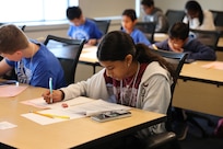 Students solve timed math problems during the individual “Target” and “Sprint” rounds of the Carderock Math Contest (CMC) at Naval Surface Warfare Center, Carderock Division