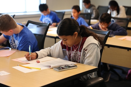 Students solve timed math problems during the individual “Target” and “Sprint” rounds of the Carderock Math Contest (CMC) at Naval Surface Warfare Center, Carderock Division