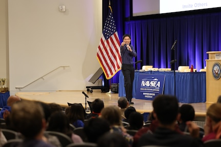 Po-Shen Loh, a mathematics professor at Carnegie Mellon University, gives a presentation to middle school students during the 15th annual Carderock Math Contest (CMC) at Naval Surface Warfare Center, Carderock Division