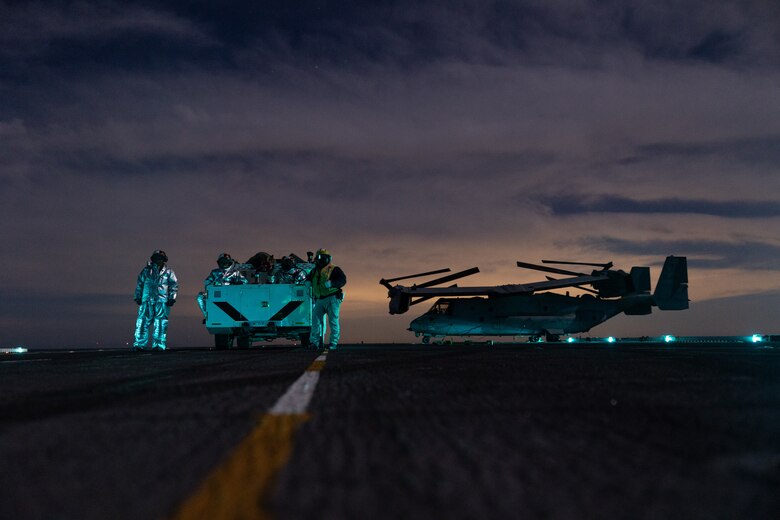 U.S. Sailors assigned to Wasp-class amphibious assault ship USS Boxer (LHD 4), supervise flight deck operations in the Pacific Ocean, Dec. 3, 2025. The 11th MEU is currently underway aboard the Boxer Amphibious Ready Group in the U.S. 3rd Fleet area of operations conducting integrated training that enhances lethality and warfighting readiness. (U.S. Marine Corps photo by Cpl. Oliver Nisbet)