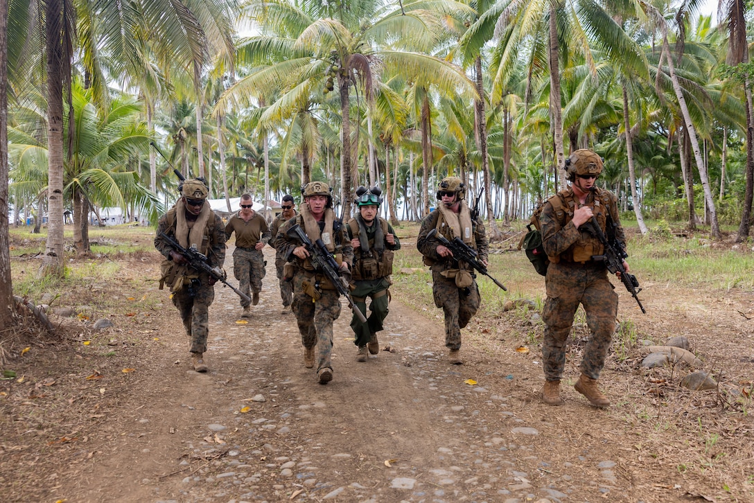 U.S. Marines assigned to 1st Battalion, 5th Marine Regiment, Marine Rotational Force - Darwin, recover and escort a simulated casualty to an MV-22B Osprey tiltrotor aircraft during a tactical recovery of aircraft and personnel exercise as part of Exercise Balikatan 2026 at Philippines Naval Detachment Oyster Bay, Palawan, Philippines, May 1, 2026. Balikatan is a longstanding annual exercise between the Armed Forces of the Philippines and U.S. military that represents the strength of our alliance, improves our capable combined force, and demonstrates our commitment to regional peace and prosperity. (U.S. Marine Corps photo by Cpl. Caleb Goodwin)