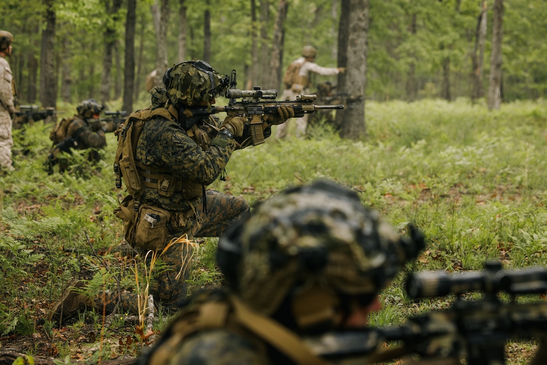 U.S. Marine Corps Lance Cpl. Ezekiel McNeely, a field radio operator with 1st Battalion, 1st Marine Regiment, 1st Marine Division, engages targets during the Marine Corps Rifle Squad Competition at Marine Corps Base Quantico, Virginia, April 29, 2026. The Marine Corps Rifle Squad Competition is an annual competition that utilizes simulated combat conditions to challenge competitors with a wide variety of complex and realistic scenarios to determine which Marine rifle squad most effectively demonstrates their combat capabilities and operational proficiency. (U.S. Marine Corps photo by Cpl. Joshua Barker)